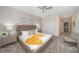 Main bedroom with plush bed, gray walls and carpet flooring at 2744 Bookmark Dr, Kissimmee, FL 34746
