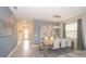 Bright dining room with a large table and modern chairs near the entryway at 2744 Bookmark Dr, Kissimmee, FL 34746