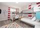 ' bedroom with a set of bunk beds, whimsical decor, and red and white curtains at 2744 Bookmark Dr, Kissimmee, FL 34746
