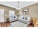 Cozy living room with two sofas and a decorative rug at 3227 Cupid Pl, Kissimmee, FL 34747