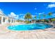 Relaxing resort-style pool with surrounding lounge chairs at 3227 Cupid Pl, Kissimmee, FL 34747