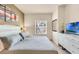 Spacious Primary bedroom with a king-size bed and large window at 3227 Cupid Pl, Kissimmee, FL 34747