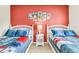 ' bedroom with two twin beds and Mickey Mouse theme at 3227 Cupid Pl, Kissimmee, FL 34747