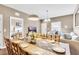 Dining room with table, chairs, and view into living room at 3227 Cupid Pl, Kissimmee, FL 34747