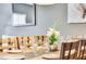 Elegant dining room with wooden table and wine glasses at 3227 Cupid Pl, Kissimmee, FL 34747