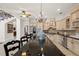 Modern kitchen with granite countertops and stainless steel appliances at 7459 Gathering Dr, Reunion, FL 34747