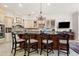 Large kitchen island with seating and granite countertop at 7459 Gathering Dr, Reunion, FL 34747
