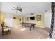 Game room with pool table, ceiling fans, and ample space for entertainment at 7459 Gathering Dr, Reunion, FL 34747