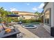 Backyard oasis with a refreshing pool, spa, and fire pit at 7459 Gathering Dr, Reunion, FL 34747