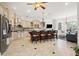 Spacious kitchen with an island, stainless steel appliances, and custom cabinetry at 7459 Gathering Dr, Reunion, FL 34747