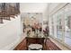 Formal dining room with a glass table and access to the kitchen at 7459 Gathering Dr, Reunion, FL 34747