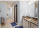 Spa-like bathroom with granite vanity, shower, and toilet at 7459 Gathering Dr, Reunion, FL 34747