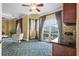 Open living area with balcony access, and built in cabinetry at 7459 Gathering Dr, Reunion, FL 34747