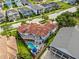 Aerial view of house and neighborhood, highlighting the property's location at 7459 Gathering Dr, Reunion, FL 34747