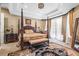 Luxurious main bedroom featuring a king-size bed and elegant decor at 7459 Gathering Dr, Reunion, FL 34747