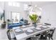 Bright dining area with a large table and seating for eight at 3028 Protagonist St, Kissimmee, FL 34746