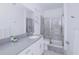 Modern bathroom featuring a walk-in shower and single vanity at 3028 Protagonist St, Kissimmee, FL 34746