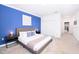 Serene bedroom with a king-size bed and calming blue decor at 3028 Protagonist St, Kissimmee, FL 34746