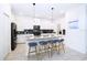 Modern kitchen with white cabinets, stainless steel appliances, and an island at 3028 Protagonist St, Kissimmee, FL 34746