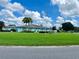 Community clubhouse with lush landscaping at 5013 Foxwood Blvd, Lakeland, FL 33810