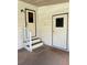 Side entrance with steps leading to two doors at 5013 Foxwood Blvd, Lakeland, FL 33810