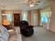 Relaxing living room with recliner, sofa, and large windows at 5013 Foxwood Blvd, Lakeland, FL 33810