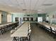 Spacious community room with tables and chairs at 5013 Foxwood Blvd, Lakeland, FL 33810