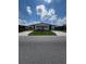Single-wide manufactured home with carport and landscaped yard at 5013 Foxwood Blvd, Lakeland, FL 33810