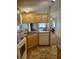 Kitchen with a breakfast bar, double sink, and view into dining area at 5013 Foxwood Blvd, Lakeland, FL 33810