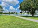 Serene lake with walking path and fountain at 5013 Foxwood Blvd, Lakeland, FL 33810