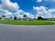 Community clubhouse with a flagpole and green lawn at 5013 Foxwood Blvd, Lakeland, FL 33810