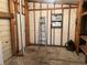 Unfinished workshop with shelving, window, and a ladder at 5013 Foxwood Blvd, Lakeland, FL 33810