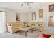 Living room featuring two beige sofas and a coffee table at 2419 Willow Tree Ln, Kissimmee, FL 34758