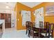 Dining area with a dark wood table and six chairs at 2419 Willow Tree Ln, Kissimmee, FL 34758