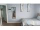 Bright bedroom with twin bed, mirror, and wall art at 730 Brunello Dr, Davenport, FL 33897