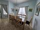 Bright dining room with wood table and chairs at 730 Brunello Dr, Davenport, FL 33897
