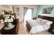 King-size bed, dresser, and patio door in spacious bedroom at 730 Brunello Dr, Davenport, FL 33897