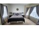 King-size bed, nightstands, and large windows in bedroom at 730 Brunello Dr, Davenport, FL 33897