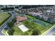 Aerial view of community with tennis court and clubhouse at 730 Brunello Dr, Davenport, FL 33897