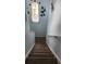 Staircase with light blue walls and brown carpet at 730 Brunello Dr, Davenport, FL 33897