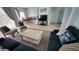 Living room with view into dining and kitchen areas at 730 Brunello Dr, Davenport, FL 33897