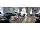 Living area with seating and access to patio at 730 Brunello Dr, Davenport, FL 33897