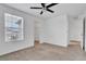 Spacious bedroom with neutral carpeting and large window at 3920 Saltmarsh Loop, Sanford, FL 32773