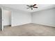 Large bedroom with plush carpeting and access to a walk-in closet at 3920 Saltmarsh Loop, Sanford, FL 32773