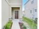 Inviting exterior featuring a charming walkway and well-manicured landscaping at 3920 Saltmarsh Loop, Sanford, FL 32773