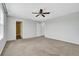 Primary bedroom with carpet, ceiling fan and access to the Primary bath at 3920 Saltmarsh Loop, Sanford, FL 32773