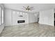 Open living space with a modern fireplace and tile flooring at 3920 Saltmarsh Loop, Sanford, FL 32773