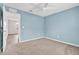 Bright bedroom with access to another room and ceiling fan at 3920 Saltmarsh Loop, Sanford, FL 32773