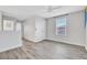 Spacious bedroom with wood-look flooring and a ceiling fan at 3920 Saltmarsh Loop, Sanford, FL 32773