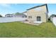 Private backyard with grassy area and patio at 3920 Saltmarsh Loop, Sanford, FL 32773